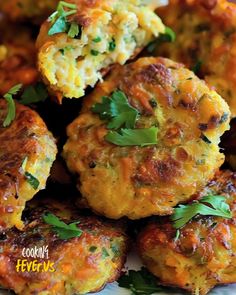 several crab cakes on a plate with parsley sprinkled on the top and bottom