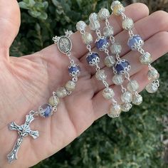 NOTE: Rosary orders for FULL Rosaries will take 6-8 weeks for completion. THIS LISTING IS FOR ONE rosary.  This rosary is a full set of 59 beads with your preserved flowers. Findings may vary. If you need a certain cross or medallion please message me before placing an order so I can be sure to get it for you.  Your rosary may look different depending on your flowers. this item is all handmade so no two beads or rosaries will look alike.  Want something smaller? Please see the Chaplet listing: h Spiritual Rosary With Crucifix For First Communion, Spiritual Rosary For First Communion, Gift Rosary With Polished Beads And Cross, Spiritual Crucifix Rosary For First Communion, Gift Rosary With Polished Beads, First Communion Spiritual Rosary With Crucifix, Elegant Healing Rosary With Round Beads, Healing Rosary With Miraculous Medal And Round Beads, Luxury Rosary With Round Beads As Gift