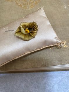 a decorative pillow with a flower on it