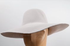 This Light Grey fur felt capeline hat body is made from 100% rabbit fur and has been stiffened to help in the hat blocking process. Great for making hats in the traditional way. With a larger brim width of 115mm, these men's fur felt hat bodies are a heavier felt at 159g and come with extra stiffening making them perfect for fedoras, trilbies, homburgs, etc. Technical Spec: 100% Rabbit Fur* Brim width: 115mm Weight: 159g Stiffening: 2.0o Some colour felts are stiffer than others, but all block u White Fur Felt Hat For Winter, White Fur Felt Winter Hat, Beige Fur Felt Fedora Hat, Winter Wide Brim Fur Felt Hat, Solid Wide Brim Fur Felt Hat, Solid Color Wide Brim Fur Felt Hat, White Curved Brim Fur Felt Hat, Fitted Wide Brim Fur Felt Hat, Solid Fur Felt Top Hat With Wide Brim