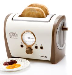 two slices of toast on a plate next to a toaster with jelly in it