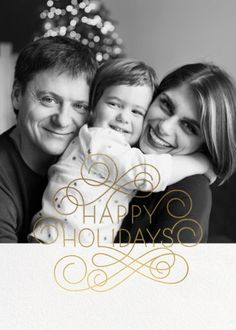 a black and white photo with the words happy holidays written in gold foil on it