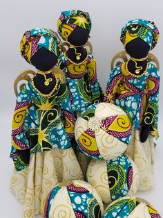 a group of cloth dolls sitting next to each other