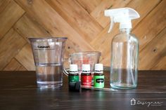 the contents of a diy wood floor cleaner are displayed on a wooden table next to an empty glass container