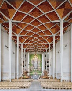 the inside of a church with rows of chairs