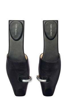 A hardware-detailed toe ring pierces the vamp of a rich leather mule fashioned with a slender square toe for statement-making appeal. 1 1/4" heel Leather upper, lining and sole Imported Tory Burch Mules, Mode Shoes, Dr Shoes, Shoe Inspo, Leather Slippers, Leather Mules, Dream Shoes, Mode Inspiration, Shoe Game