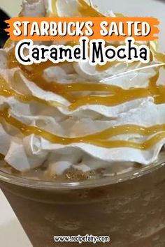 starbucks caramel mocha is topped with whipped cream and drizzled orange syrup