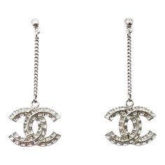 Chanel Silver CC Princess Square Crystal Dangle Long Piercing Earrings * Marked 20 * Made in Italy *Comes with original box and pouch -It is approximately 2.2″ x 0.9″ -It is one of the most popular Chanel items. -In a pristine condition AB4280-00530  Please see the measurements section for best approximate dimensions. Chanel Logo Earrings, Chanel Items, Square Crystal, Piercing Earrings, Clothing Pieces, Chanel Logo, Chanel Earrings, Chanel Vintage, Accessories Jewelry Earrings