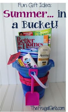 a bucket filled with books and magazines on top of a white table next to the words, fun gift idea summer in a bucket