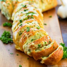 the bread has been sliced and is ready to be eaten with parsley on top