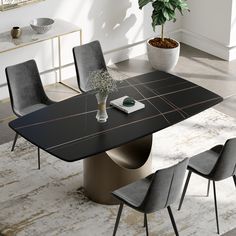 a black marble dining table with grey chairs and a potted plant in the corner