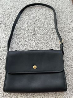 Rare Vintage Coach Leather Court Bag in Black, Creed: 015-3127  - Made In United States  - Condition: Very Good Condition as a Vintage Bag- Minor spots/marks/scratches are found on the leather; some rust spots are found on the hardware; no odour. (Please see pictures for details) - Size(Approximate): 12"(L)x 8"(H)x 2"(W) - Color: Black - Material: Full Grain Leather Satchel Shoulder Bag With Snap Closure For Work, Workwear Satchel Shoulder Bag With Snap Closure, Workwear Crossbody Bag With Snap Closure, Workwear Crossbody Shoulder Bag With Snap Closure, Workwear Satchel Bag With Snap Closure, Snap Closure Satchel For Work, Casual Work Bags With Snap Closure, Casual Workwear Bag With Snap Closure, Vintage Coach