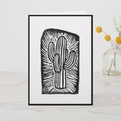 a card with a black and white drawing of a cactus