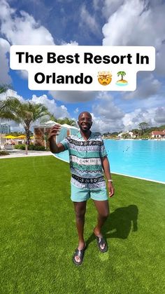 a man standing in front of a swimming pool with the words the best resort in orlando above him