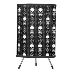 a black and white display case with skulls on the front, one side is open