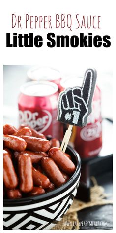 a bowl filled with hot dogs next to two cans of dr pepper bbq sauce