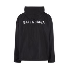 Balenciaga oversized jacket in black nylon with contrasting logo print at back. Hood, double-slider zip closure, long sleeves, front pockets, and drawstring edges. Balenciaga Logo, Balenciaga Black, Lettering Logo, Balenciaga Mens, Oversized Jacket, Top Designer Brands, Black Nylon, High End Fashion, Black Nylons