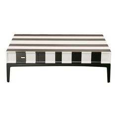 a black and white striped coffee table with drawers