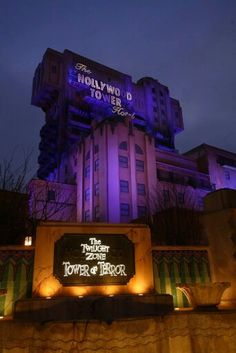 the tower of terror sign lit up at night