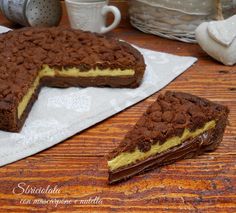 two pieces of cake sitting on top of a wooden table