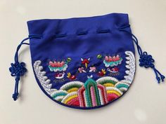 Traditional Multicolor Embroidered Pouch For Gifts, Traditional Blue Bags Suitable For Gifts, Traditional Multicolor Embroidered Pouch As Gift, Gift Multicolor Embroidered Pouch, Embroidered Blue Pouch As Gift, Embroidered Multicolor Pouch As Gift, Embroidered Blue Pouch For Gift, Embroidered Blue Pouch For Gifts, Blue Embroidered Pouch For Gift