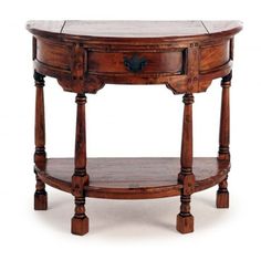 an oval wooden table with two drawers