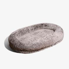 a dog bed that is made out of fur