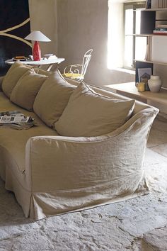 a couch that has some pillows on it