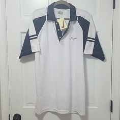 Vintage 1990s Nike Deadstock Polo New With Tags. Polo Is A Size Men's Xl With Ribbed Fabric. Offers Welcome, Ships Fast And From A Smoke Free Home. Nike Cotton Short Sleeve Polo Shirt, Nike Casual Short Sleeve Polo Shirt, Casual Nike Cotton Polo Shirt, Retro Nike Sports Tops, Casual Nike Golf Tops, Navy Polo Shirt, Shirts Nike, Grey Polo Shirt, Nike Polo