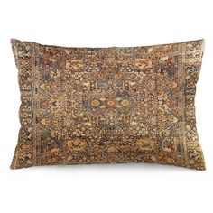 an antique rug pillow on a white background