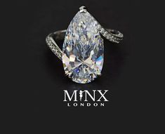 a pear shaped diamond ring on a black background with the words mmx london written below it