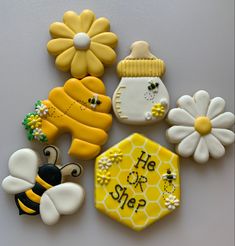 decorated cookies with bees, honey combs and flowers