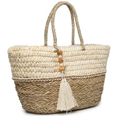 This Bag Is A Lovely, Two-Tone Tote Made Of Natural Seagrass. It Features Metallic Thread Woven Through It As Well As A Wood-Trimmed Tassel. The Inside Is Lined With A Zip Pocket To Carry Your Most Important Belongings! Natural Two-Tone Seagrass Tote Soft Rope Handle Wood Tassel Trim Dimension: 21"L X 12"H X 9"D Weight: 2.5 Lbs Baggu Duck Bag, Summer Tote Bag, Boat Tote, Duck Bag, Summer Tote Bags, Tan Handbags, Halloween Tote Bag, Vera Bradley Tote, Summer Tote