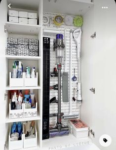 a white shelf filled with lots of crafting supplies and items on top of it