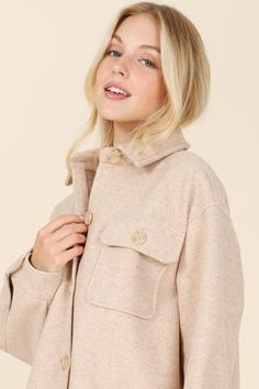 This light beige shacket features 5 buttons at the center front, one button at each chest pocket and cuff, and two pockets at each chest. The yoke is located at the back, and the shirt tail is finished with a regular sleeve and drop shoulder. This piece does not have any stretch, but is not sheer, and the care instructions recommend machine washing cold with like colors, only non-chlorine bleach when needed, tumble dry low, and cool iron if needed. Our model is 5' 6" and is wearing a size Small. Beige Shacket, Yoke Shirt, Tail Pattern, Beige Shirt, Beige Jacket, Pocket Light, Jeans Size Chart, Shirt Collar, Classic Shirt