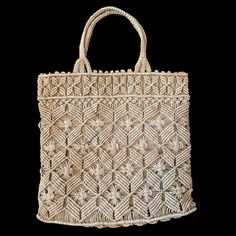 a white woven bag on a black background