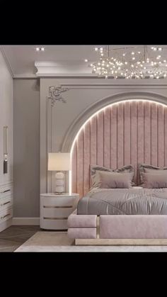 a bedroom with a pink bed and chandelier in the corner, along with two nightstands on either side