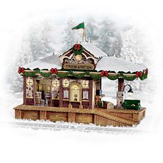 the christmas train station is decorated with lights and decorations on it's front porch