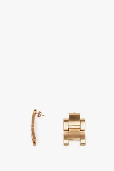 The iconic watch strap detail is reinvented as contemporary brass earrings for the festive season. Adorned by an elegant butterfly closing at the back, these beautifully crafted earrings are made in Italy and stamped with the Victoria Beckham logo. Victoria Beckham Jumbo Chain Earrings in Brushed Gold QTY UK size Designer Gold-tone Earrings As Gift, Designer Metal Jewelry For Evening, Timeless Rectangular Earrings For Formal Occasions, Timeless Rectangular Formal Earrings, Elegant Jewelry With Gold-tone Hardware For Formal Occasions, Designer Gold-tone Earrings For Formal Occasions, Elegant Formal Jewelry With Gold-tone Hardware, Formal Matte Gold Metal Jewelry, Bronze Metal Jewelry For Evening