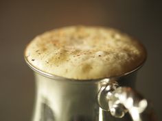 a close up of a metal cup on a table