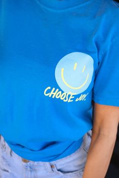 Spread happiness with our Choose Joy Graphic Tee 😊! This playful tee features a joyful print on both front and back, so you can share your positive vibes wherever you go. Say goodbye to boring tees and choose joy (and comfort!) with this front & back printed tee. 😃 Fit: Unisex; True to Size Material: 100% ring spun cotton Neck: Crew Style: Short-Sleeve Care Instructions: Wash Cold + Hang Dry Designed and Made in Texas Tees are screen printed with high-quality ink to prevent fading Elsie De Wolfe, Choose Joy, Athleisure Wear, Comfort Color, Vintage Santas, Beach Babe, Dress Romper, Positive Vibes, Graphic Tee