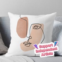 a pillow with the words support independent artists on it and an image of a woman's face