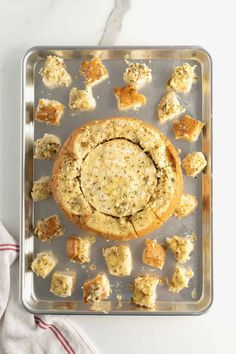 an overhead view of a cookie tray with cookies and muffins on it