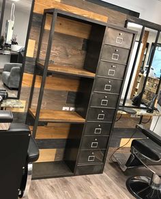 a hair salon with lots of drawers and chairs