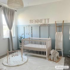 a baby's room with a crib, rocking horse and other items on the floor