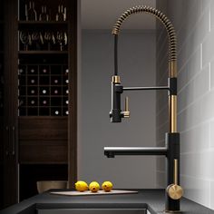 a kitchen with a sink, faucet and counter top in black and gold