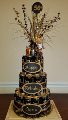 a 50th birthday cake made out of wine bottles