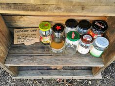 an old wooden crate filled with different types of condiments