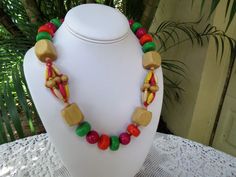 "This strand of Painted Wood Beads is in excellent condition. The beads measure a nice chunky 3/4\" in diameter. This old kitschy necklace measures 21\" long. It is perfect for summer because it is a really light weight. Perfect for beach or resort glam. Have fun with this one. Please view the photos as part of the description and feel free to ask a question. Thank you for your interest." Retro Wooden Bead Jewelry, Retro Wooden Round Bead Jewelry, Vintage Wooden Bead Necklaces For Beach, Vintage Wooden Beaded Necklaces For Beach, Vintage Wooden Beaded Necklace For Beach, Retro Large Beads For Gifts, Costume Jewelry Beaded Necklace With Wooden Round Beads, Costume Jewelry Beaded Necklace With Wooden Beads, Vintage Beaded Necklaces With Round Beads For Beach