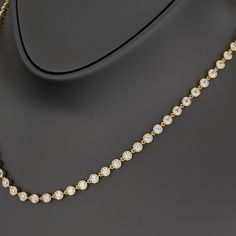 Indulge in elegance with our 8.24 Carat Bezel Set Round Cut Diamond Choker Necklace, crafted in 10K/14K/18K gold. Featuring lab-grown diamonds in a minimalist design, this stunning piece exudes timeless beauty and sophistication. Perfect as a personalized birthday gift for her, this necklace is a luxurious statement of refined style and sustainable craftsmanship. 𝐅𝐞𝐚𝐭𝐮𝐫𝐞𝐬:• 𝐌𝐚𝐝𝐞 𝐭𝐨 𝐎𝐫𝐝𝐞𝐫• 𝐌𝐞𝐭𝐚𝐥: 𝟏𝟎𝐊 𝐆𝐨𝐥𝐝 | 𝟏𝟒𝐊 𝐆𝐨𝐥𝐝 | 𝟏𝟖𝐊 𝐆𝐨𝐥𝐝 • 𝐁𝐚𝐧𝐝 𝐂𝐨𝐥𝐨𝐫𝐬: Luxury Minimalist Round Charm Necklaces, Luxury Minimalist Round Tennis Necklace, Luxury Sapphire Birthstone Necklace, Round Shape, Luxury Round Cut Birthstone Necklace Gift, Luxury Minimalist Round Cut Diamond Necklace, Luxury Diamond Cut Round Birthstone Necklace, Luxury Round Diamond Cut Birthstone Necklace, Luxury Diamond Birthstone Necklace With Bezel Setting, Luxury Minimalist Birthstone Necklace With Bezel Setting